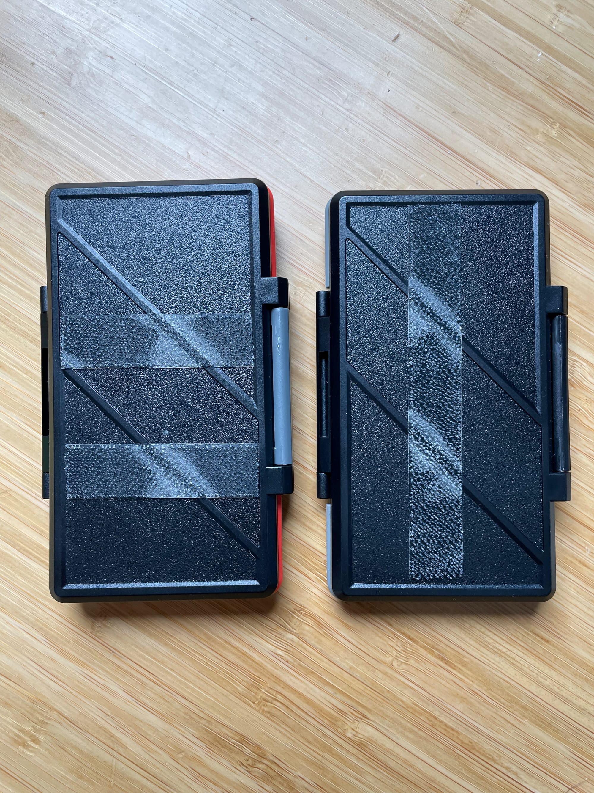 Here you can see the clear dual lock tape on the back of my SD card cases. This makes it really easy to keep them stuck together. 